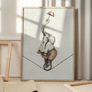 Tablou înramat „ Unicycle While Holding An Umbrella” de Mike Koubou